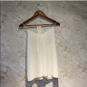 White sleeveless racer back top with gold buttons